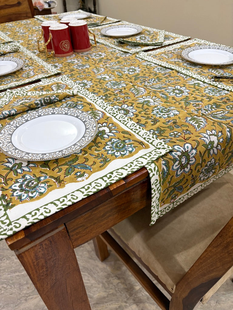 Patterned tablecloth on a wooden dining table 